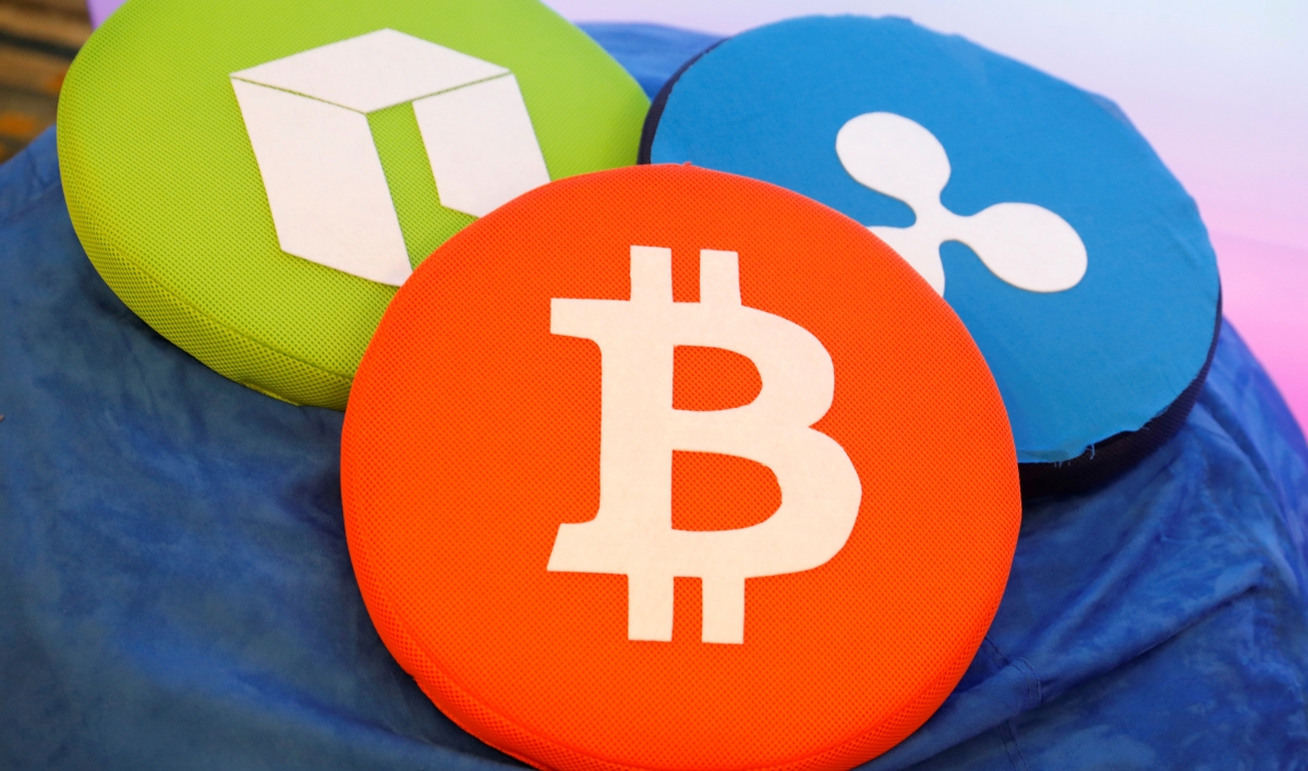 The Bitcoin logo is seen on a pillow on display at the Consensus 2018 blockchain technology conference in New York City, May 16, 2018. Reuters / Mike Segar