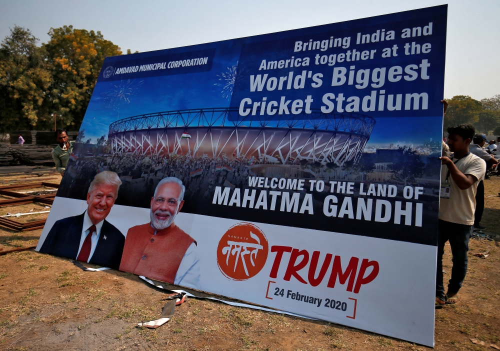  Workers prepare a hoarding with the images of the U.S. President Donald Trump and India's Prime Minister Narendra Modi ahead of Trump's visit, on the outskirts of Ahmedabad, India, February 19, 2020. REUTERS/Amit Dave 
