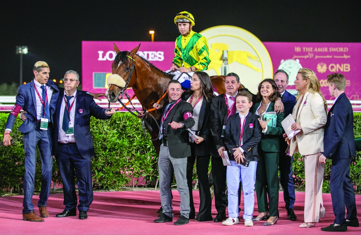 Stunning Spirit and  the team mambers celebrate after winning yesterday's feature race.