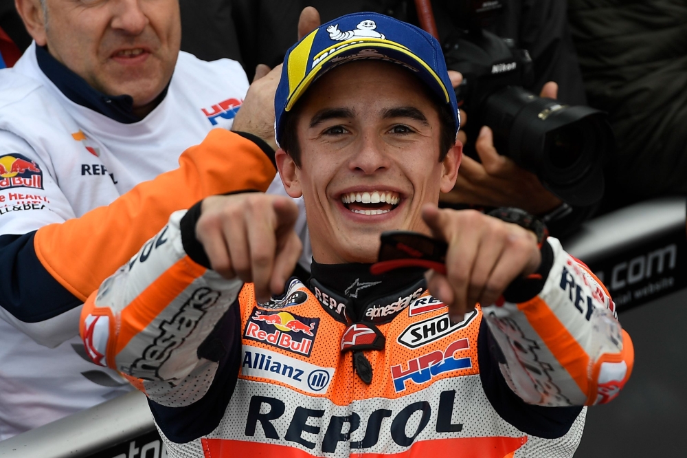 In this file photo taken on November 17, 2019 Repsol Honda Team's Spanish rider Marc Marquez celebrates after winning the MotoGP race of the MotoGP Valencia Grand Prix at the Ricardo Tormo racetrack in Cheste near Valencia, on November 17, 2019. / AFP /