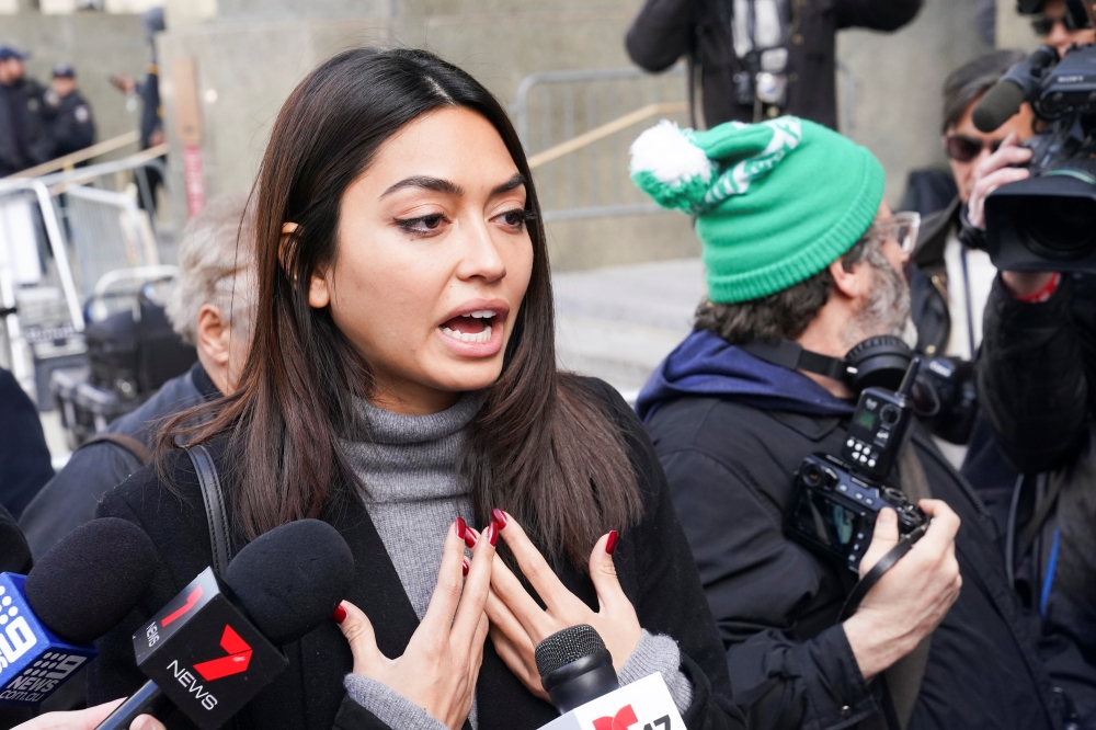 Model Ambra Battilana Gutierrez talks to the media following film producer Harvey Weinstein's guilty verdict in his sexual assault trial in New York, US February 24, 2020. Reuters/Carlo Allegri
 Model Ambra Battilana Gutierrez talks to the media followin