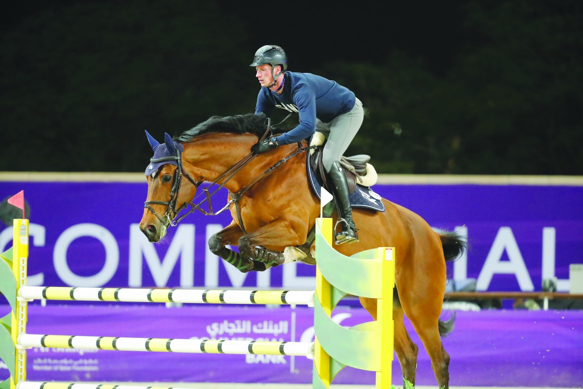 Daniel Deusser rides Kiana van het Herdershof during a warm-up session at the Longines Arena at Al Shaqab, ahead of the Commercial Bank CHI Al Shaqab presented by Longines which kicks off today.