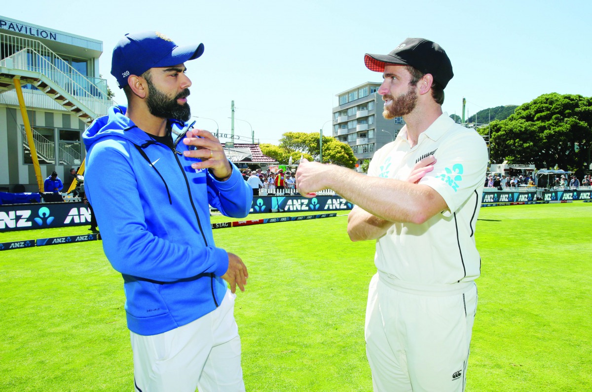 New Zealand's Kane Williamson talks to India's Virat Kohli after New Zealand beat India in the First Test. Reuters/Martin Hunter 