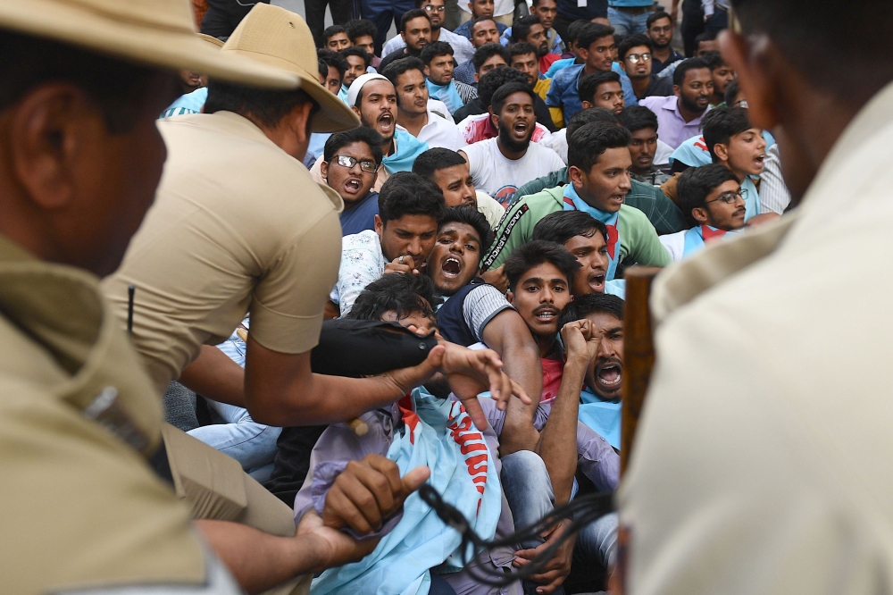 Student members of the Campus Front of India stage a protest in front of the Karnataka Governor's house, also known as the Raj Bhavan, in Bangalore on February 27, 2020.  / AFP / Manjunath KIRAN