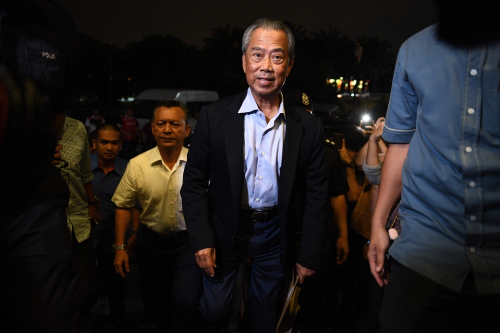 Muhyiddin Yassin (C), president of Parti Pribumi Bersatu Malaysia or Malaysian United Indigenous Party, arrives at the party headquarters in Kuala Lumpur on February 24, 2020. AFP / Mohd Rasfan  