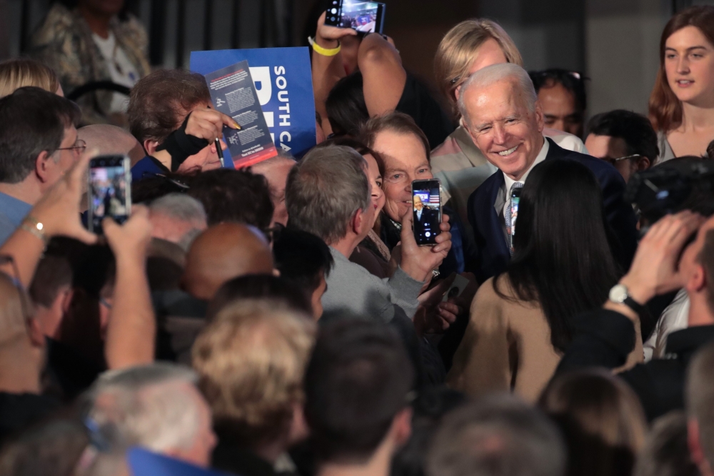 Democratic presidential candidate former Vice President Joe Biden celebrates with his supporters after declaring victory at an election-night rally at the University of South Carolina Volleyball Center on February 29, 2020 in Columbia, South Carolina. Sco