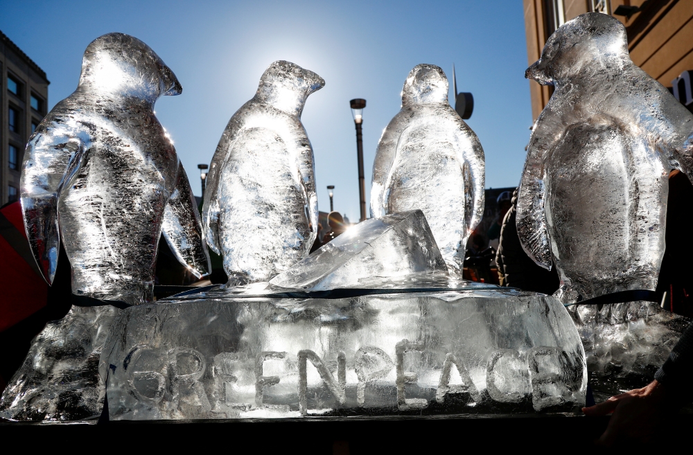A Greenpeace ice sculpture of penguins is seen during a protest by students against climate change in central Brussels, Belgium February 7, 2020. Reuters/Francois Lenoir
 
