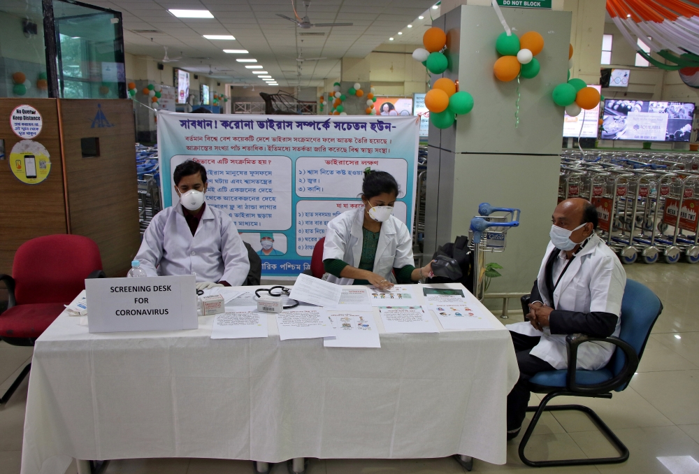 FILE PHOTO: A health desk is set up to screen travelers for signs of the coronavirus at Maharaja Bir Bikram Airport in Agartala, India, January 31, 2020. REUTERS/Jayanta Dey/File Photo