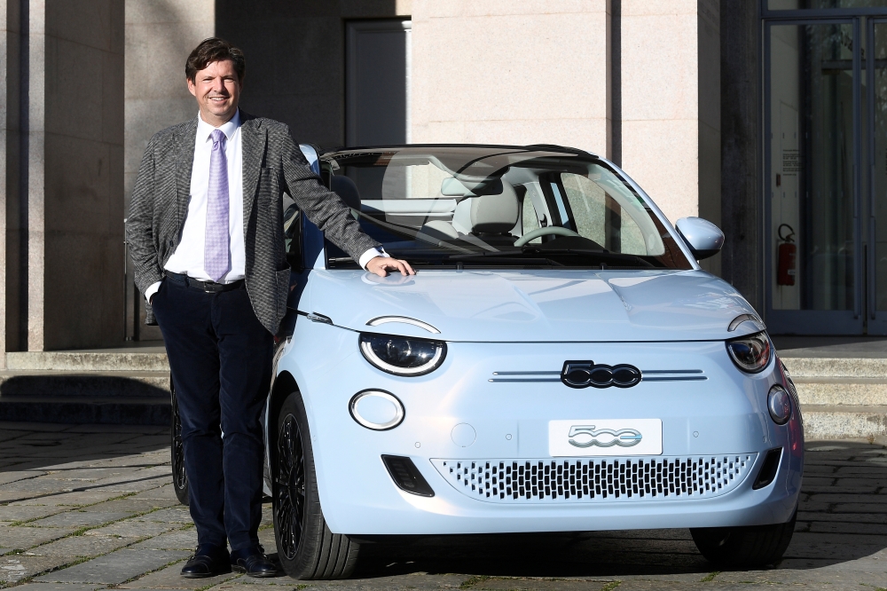 Head of Fiat brand and FCA Chief Marketing Officer Olivier Francois poses next to a new Fiat 500 electric car during an event held to unveil its first electric model, in Milan, Italy, March 4, 2020. Reuters/Flavio Lo Scalzo 