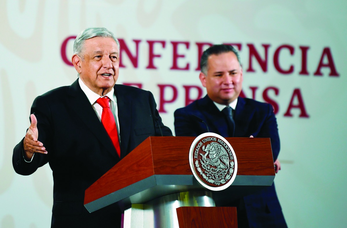 Mexican President Andres Manuel Lopez Obrador (L) speaks next to the Head of Financial Intelligence Unit of the Secretariat of Finance and Public Credit (SHCP), Santiago Nieto, during a press conference at the National Palace in Mexico City on March 4, 20