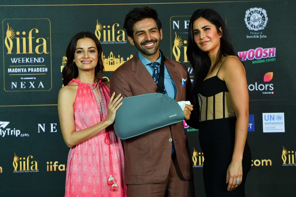  Bollywood actors Dia Mirza (L), Katrina Kaif (R) and Kartik Aaryan pose for pictures as they attend the International Indian Film Academy (iifa) press Conference for the 21st Edition of NEXA iifa Weekend & Awards 2020, in Mumbai on March 4, 2020. / AFP /