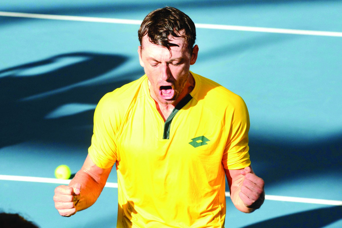 John Millman of Australia reacts after winning his Davis Cup qualifying tie tennis watch against Brazil in Adelaide on March 6, 2020. AFP / Brenton Edwards