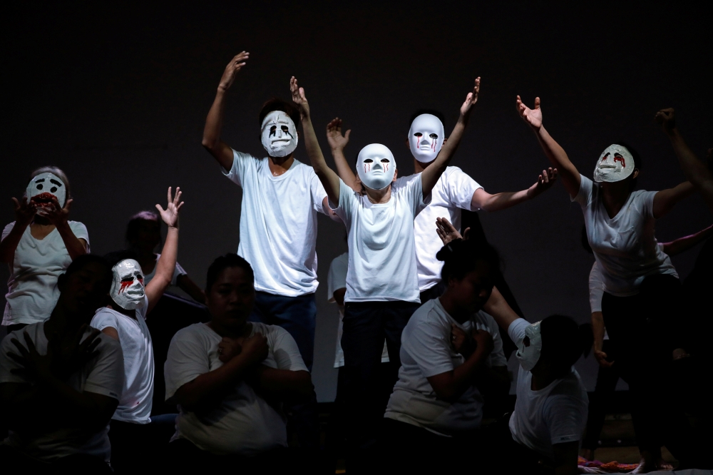 Relatives of victims killed in the Philippines' drug war act a scene during their theatre performance on their journey of loss and healing in a Catholic school in Makati City, Philippines, March 4, 2020. Reuters /Eloisa Lopez
