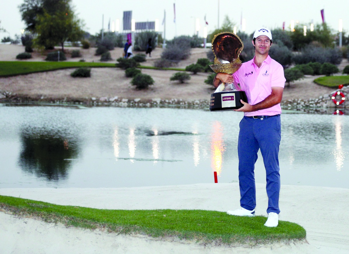Jorge Campillo, winner of the Commercial Bank Qatar Masters, poses for a picture with The Mother of Pearl Trophy during the victory ceremony at the Education City Golf Club yesterday.