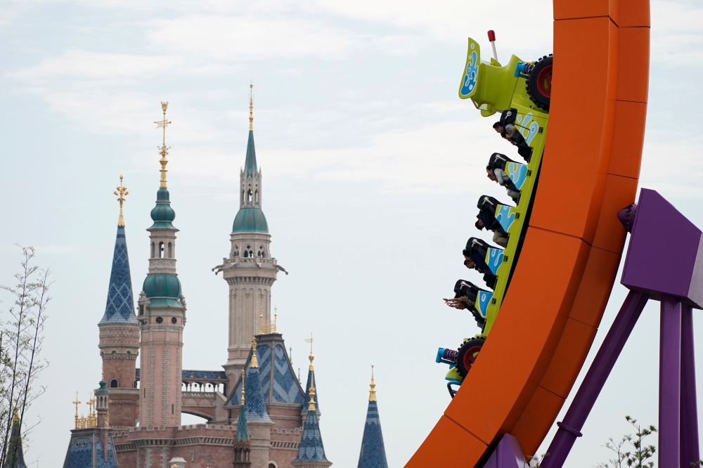  FILE PHOTO: People visit the opening event of Disney-Pixar Toy Story Land, the seventh themed land in Shanghai Disneyland in Shanghai, China April 26, 2018. REUTERS/Aly Song/File Photo 