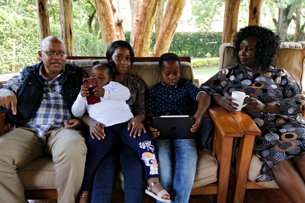 Joshua Babu and his wife Emily Chelangat, who lost their son and daughter-in-law to the Ethiopian Airlines Flight 302, sit with their family members during a Reuters interview at their home in Nairobi, Kenya March 7, 2020. Reuters/Njeri Mwangi 
 