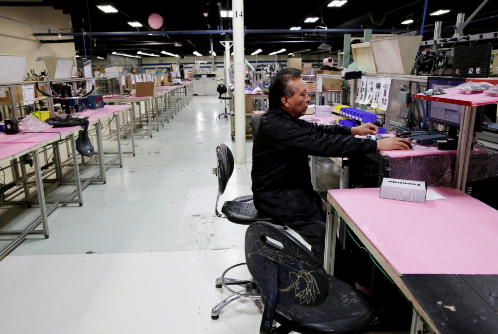 An employee of NDP Technology, a private company specializing in PCB (Printed Circuit Board) assembly for different industries, works as female employees stayed away from work during the 