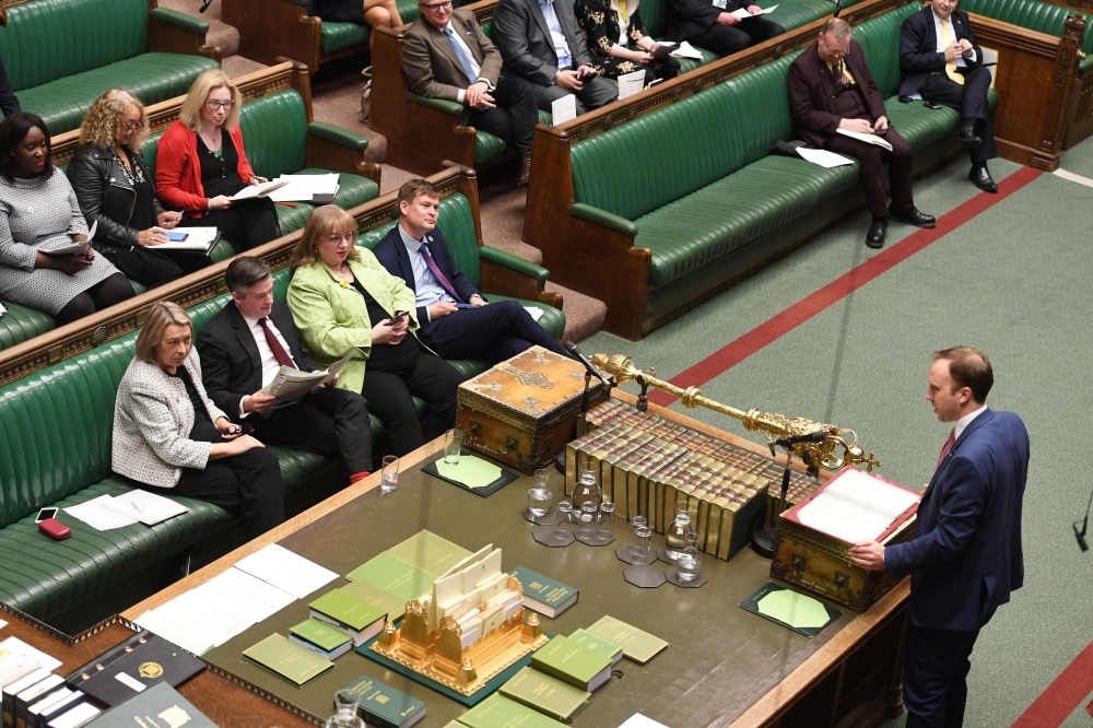 A handout picture released by the UK Parliament shows Britain's Health and Social Care Secretary Matt Hancock (R) speaking during Oral Questions to the Secretary of State for Health and Social Care in the House of Commons in London on March 10, 2020 /AFP/