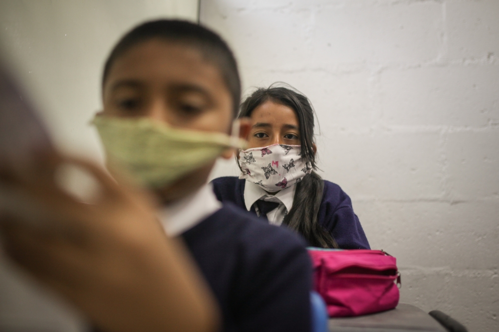 SOACHA, COLOMBIA - MARCH 11: Students are seen with their handmade face masks at the Julio Cesar Turbay school located at the urban area of ??the municipality of Soacha, a sector stigmatized by violence and lack of resources in Soacha, Colombia on March 1