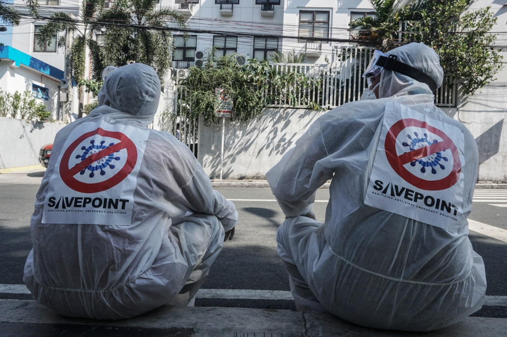 SAN JUAN, PHILIPPINES - MARCH 09: Workers wears hazmat suits as they disinfect and sanitize as precautionary measure against coronavirus at a public school in the City of San Juan in Philippines on March 09, 2020 ( DANTE DIOSINA JR - Anadolu Agency )
