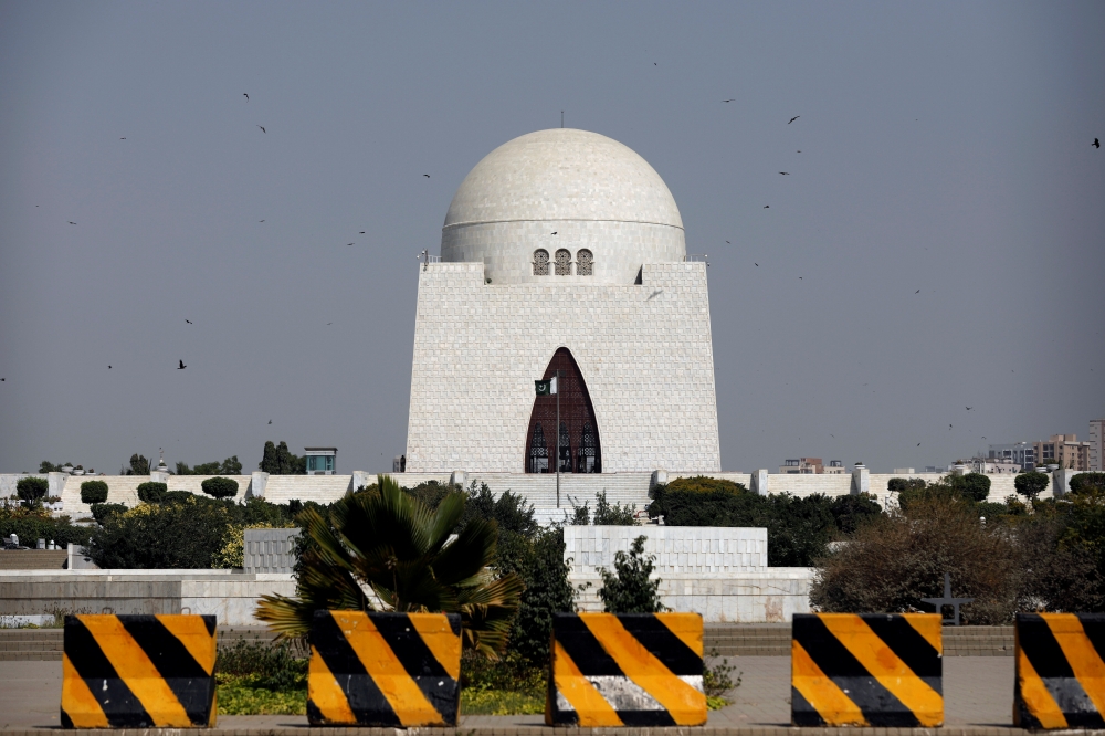 Pakistan's national flag flatters at the deserted mausoleum of Muhammad Ali Jinnah, who regarded as father of nation, after Pakistan shut all its schools and discouraged large gatherings amid coronavirus disease outbreak (COVID-19), in Karachi, Pakistan M
