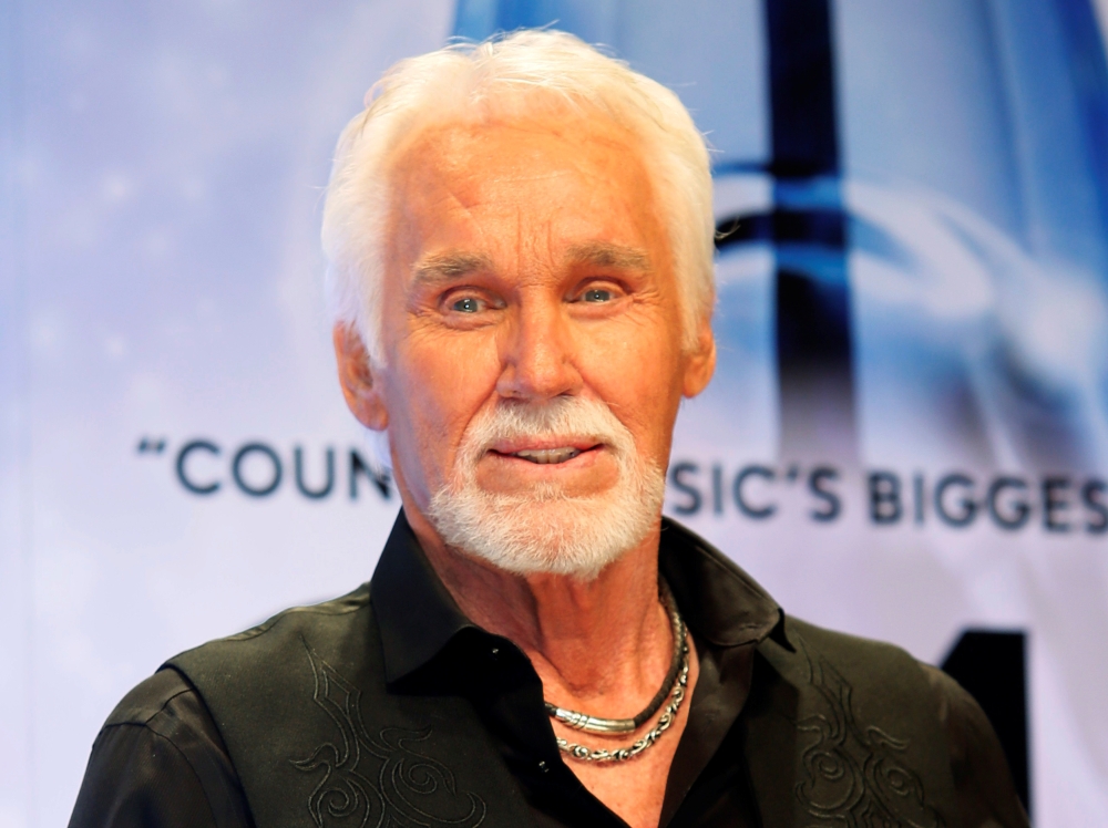 FILE PHOTO: Kenny Rogers poses backstage after accepting the Willie Nelson Lifetime Achievement award at the 47th Country Music Association Awards in Nashville, Tennessee, U.S., November 6, 2013. Reuters/Eric Henderson/File Photo