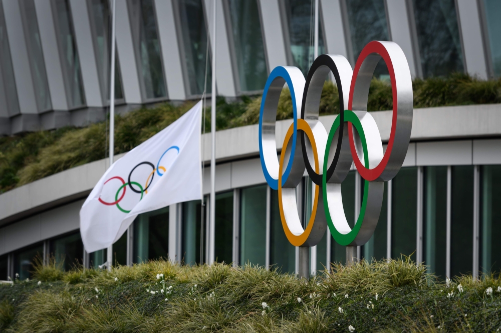 The Olympic Rings are pictured in front of the headquarters of the International Olympic Committee (IOC) in Lausanne on March 22, 2020, as doubts increase over whether Tokyo can safely host the summer Games amid the spread of the COVID-19. AFP / Fabrice C