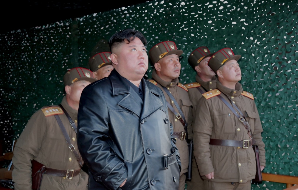 This picture taken on March 21, 2020 and released from North Korea's official Korean Central News Agency (KCNA) on March 22, 2020 shows North Korean leader Kim Jong Un observing the demonstration fire of tactical guided weapons at an undisclosed location 