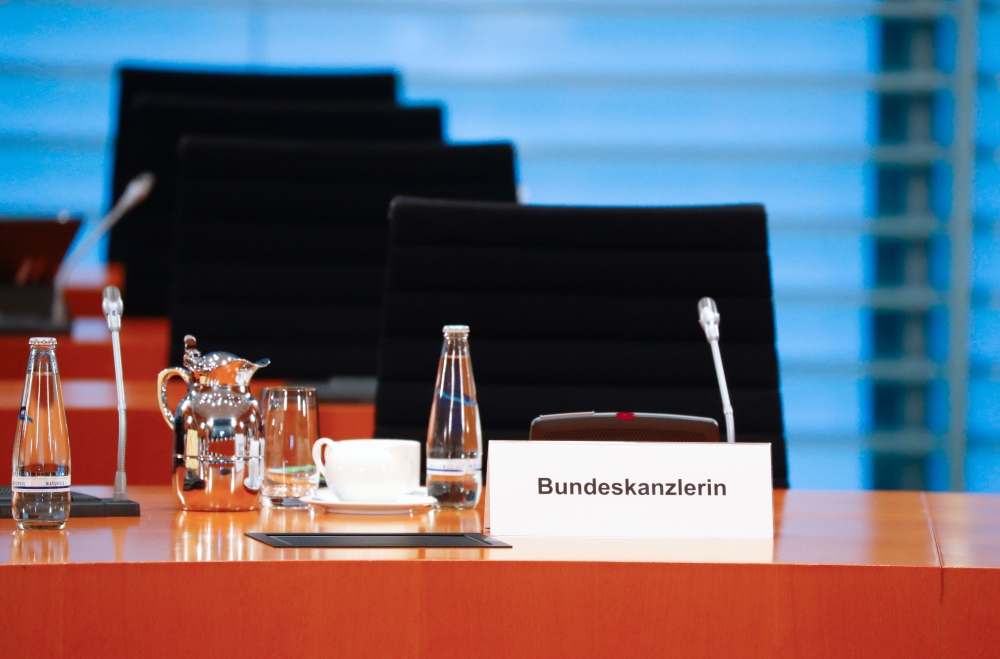 The empty chair of German Chancellor Angela Merkel is seen as she participates in the weekly cabinet meeting by video conference at the Chancellery in Berlin, on March 23, 2020. AFP / POOL / FABRIZIO BENSCH