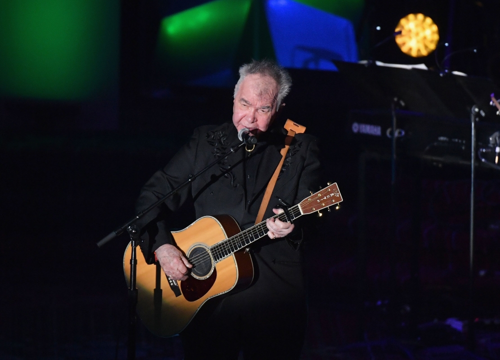 (FILES) In this file photo taken on June 13, 2019 US singer-songwriter John Prine performs onstage during the 2019 Songwriters Hall Of Fame Gala at The New York Marriott Marquis in New York City. / AFP / Angela Weiss