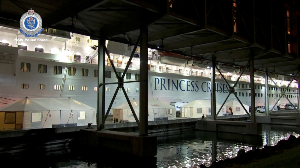 NSW Police vehicles and tents are seen during the Strike Force Bast raid of the Ruby Princess cruise ship at Port Kembla, New South Wales, Australia, April 8, 2020, in this still image from video. Video taken April 8, 2020. NSW Police via REUTERS