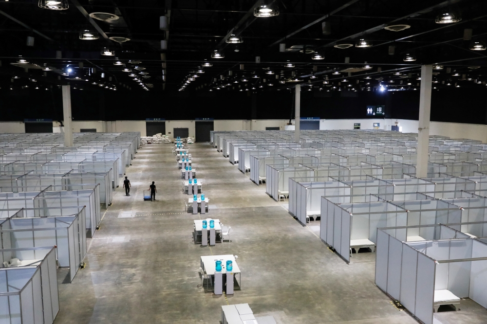 Workers walk inside World Trade Center Metro Manila, an exhibition center temporarily turned into a quarantine facility for coronavirus disease (COVID-19) patients in Manila, Philippines, April 13, 2020. REUTERS/Eloisa Lopez
