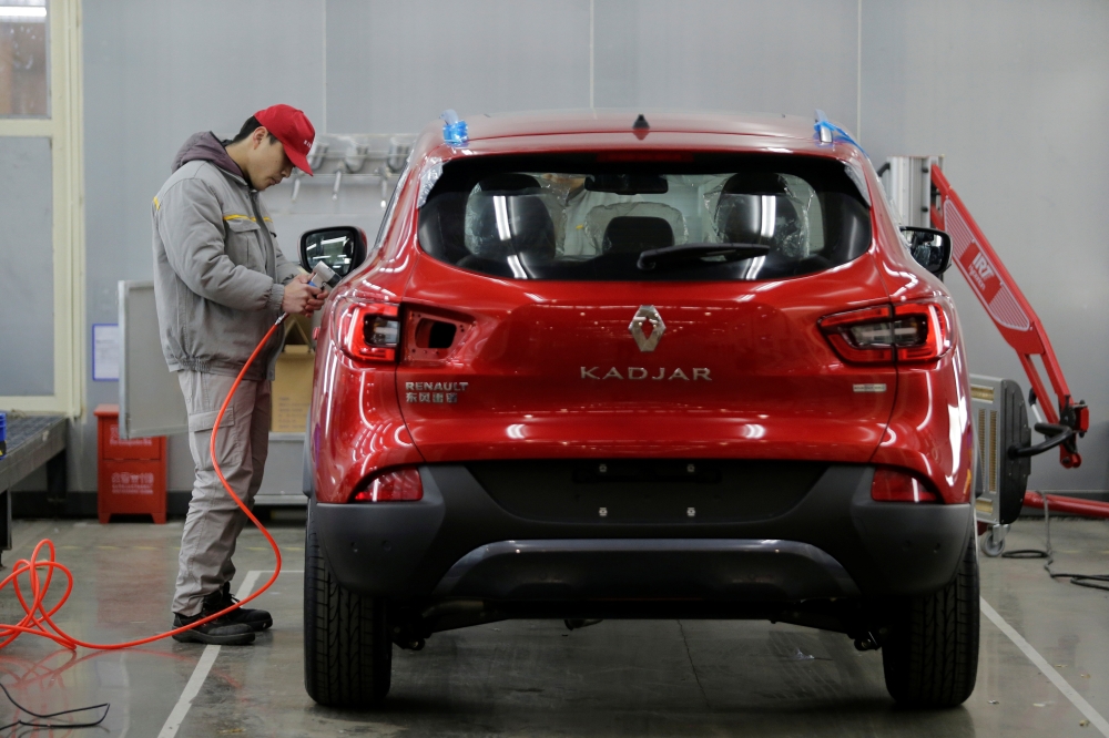 FILE PHOTO: An employee works at a Renault assembly plant in Wuhan, Hubei province, China, February 1, 2016. REUTERS/Darley Shen/File Photo