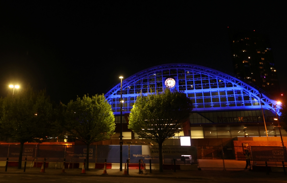 :The Nightingale Hospital lit up in blue in support of the NHS, as the spread of the coronavirus disease (COVID-19) continues, Manchester, Britain, April 16, 2020. REUTERS/Carl Recine