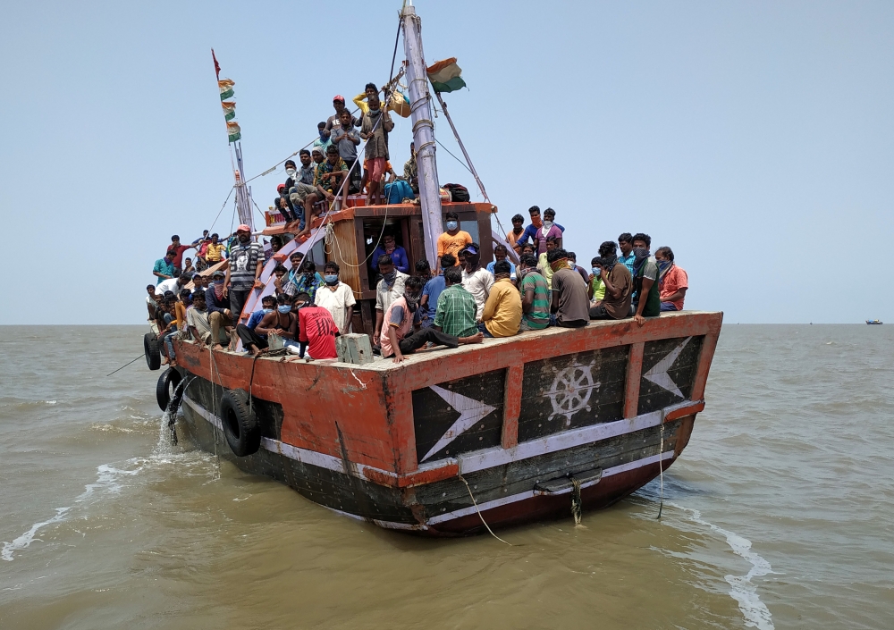 Indian fishermen, who said they were refused entry at two ports after a nationwide lockdown was imposed to fight the coronavirus disease (COVID-19), travel in the Arabian Sea attempting to reach to their home state Maharashtra from the western state of Gu