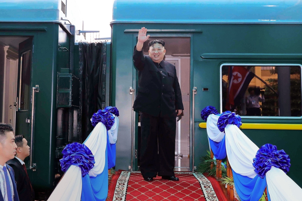 (FILES) This file photo taken on March 2, 2019 shows North Korea's leader Kim Jong Un waving before boarding his train at the Dong Dang railway station in the Vietnamese town of Lang Son./ AFP / Vietnam News Agency / STR