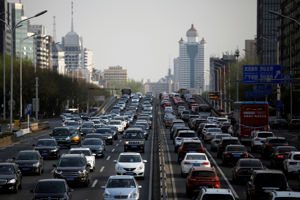 :FILE PHOTO: Cars are seen in a traffic jam during evening rush hour in Beijing, as the country is hit by an outbreak of the novel coronavirus (COVID-19), China April 8, 2020. REUTERS/Tingshu Wang/File Photo
