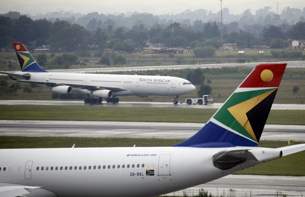 FILE PHOTO: A South African Airways (SAA) plane is towed at O.R. Tambo International Airport in Johannesburg, South Africa, January 18, 2020. Picture taken January 18, 2020. REUTERS/Rogan Ward