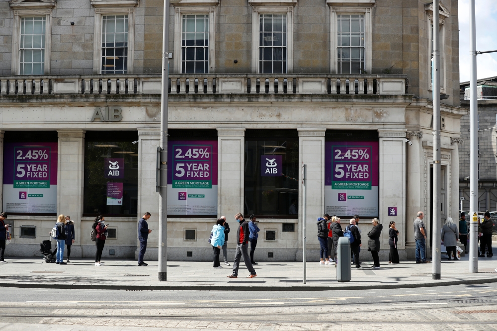 People queue outside an AIB Bank in Dublin City Centre, following the outbreak of the coronavirus disease (COVID-19), Dublin, Ireland, May 1, 2020. REUTERS/Jason Cairnduff