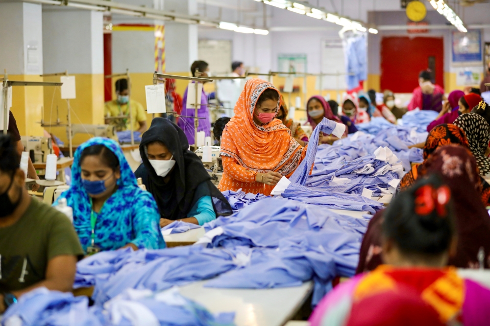 Women work in a garment factory, as factories reopened after the government has eased the restrictions amid concerns over coronavirus disease (COVID-19) outbreak in Dhaka, Bangladesh, May 3, 2020. REUTERS/Mohammad Ponir Hossain