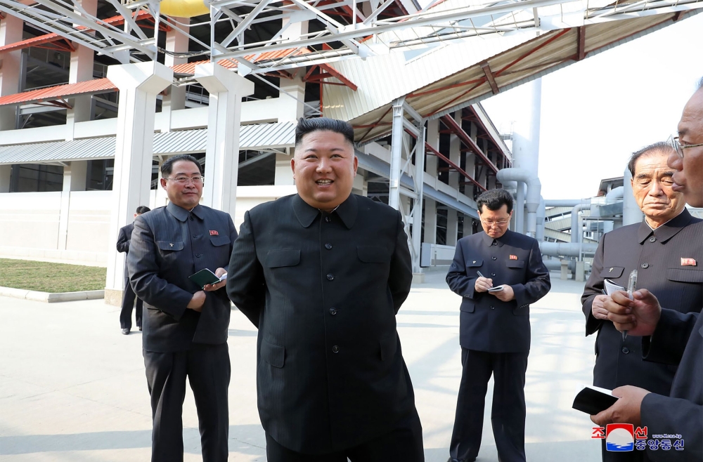 This picture taken on May 1, 2020 and released from North Korea's official Korean Central News Agency (KCNA) on May 2, 2020 shows North Korean leader Kim Jong Un (2nd L) visiting the completed Suchon phosphate fertilizer factory in South Pyongan Province,