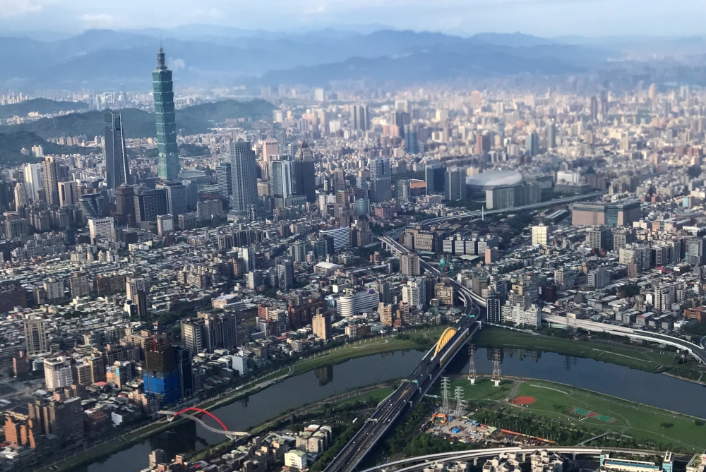 FILE PHOTO: Nan Shan Plaza (L) and Taiwan's landmark building Taipei 101 are pictured through the window of an airplane, in Taipei, Taiwan August 19, 2018. REUTERS/Tyrone Siu/File Photo
