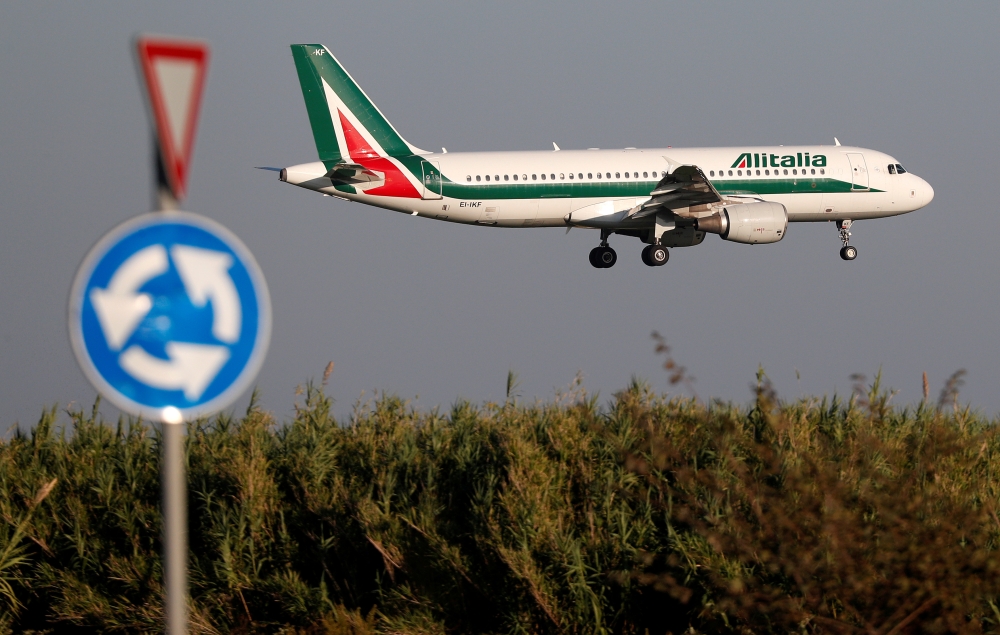 FILE PHOTO: An Alitalia Airbus A320-200 airplane approaches to land at Fiumicino airport in Rome, Italy October 24, 2018. REUTERS/Max Rossi