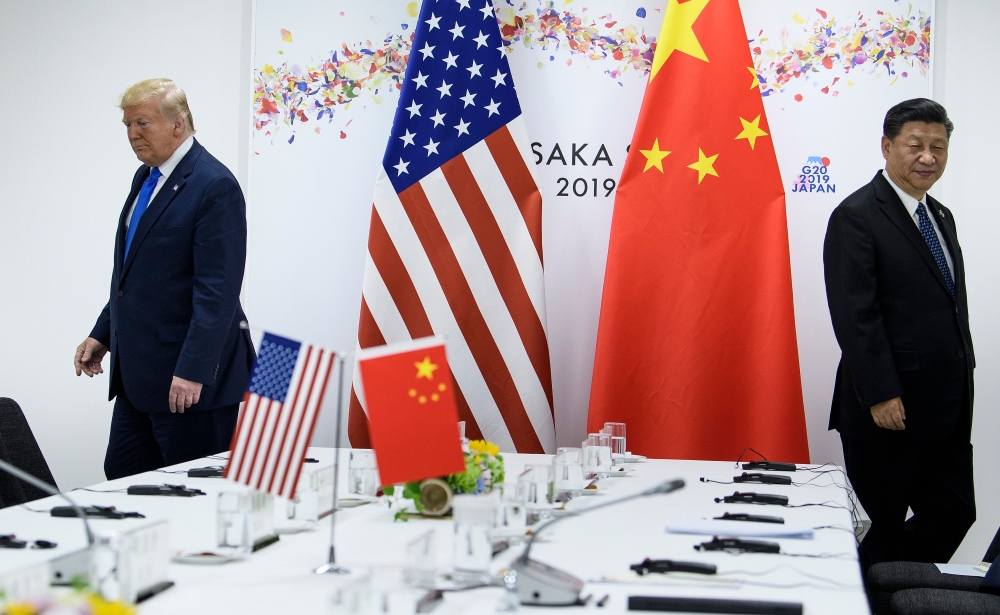 (FILES) In this file photo taken on June 29, 2019, US President Donald Trump and China's President Xi Jinping attend a bilateral meeting on the sidelines of the G20 Summit in Osaka.  / AFP / Brendan Smialowski