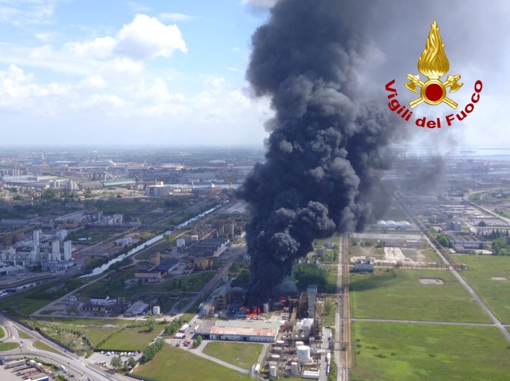 Large clouds of black smoke billow from a chemical plant after an explosion, in Marghera, near Venice, Italy, May 15, 2020. Vigili del Fuoco/Handout via REUTERS
