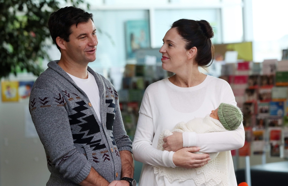In this file photo taken on June 24, 2018 New Zealand Prime Minister Jacinda Ardern and partner Clarke Gayford pose with their baby daugther Neve Te Aroha Ardern Gayford outside the hospital in Auckland. AFP / MICHAEL BRADLEY