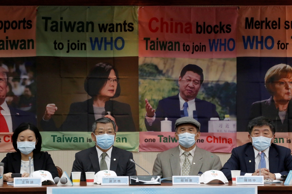 Taiwan Health Minister Chen Shih-chung, parliament members and activists hold a news conference about Taiwan's efforts to get into the World Health Organization in Taipei, Taiwan, May 15, 2020. REUTERS/Ann Wang 