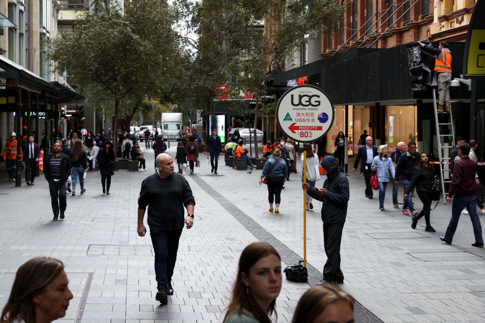 Increased foot traffic is seen in the city centre following the easing of restrictions implemented to curb the spread of the coronavirus disease (COVID-19) in Sydney, Australia, May 18, 2020. REUTERS/Loren Elliott

