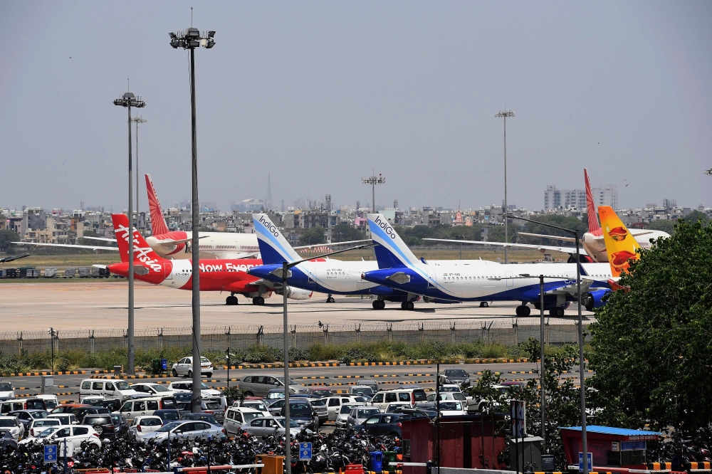 In this file photo taken on May 8, 2020 airplanes are seen at the Indira Gandhi International airport apron during a government-imposed nationwide lockdown as a preventive measure against the COVID-19 coronavirus, in New Delhi.AFP / Prakash SINGH
