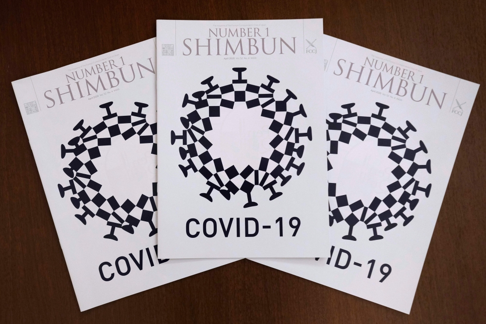 This picture taken on May 21, 2020 in Tokyo shows the cover design of Number 1 Shimbun, the monthly magazine for members of the Foreign Correspondents’ Club of Japan, which was designed by Andrew Pothecary. / AFP / Kazuhiro NOGI /

